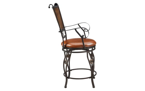Friseal Copper Faux Leather Panel Back Counter Height Stool with brown vinyl seat, steel frame, curved arms, and intricate stamped back in traditional style.