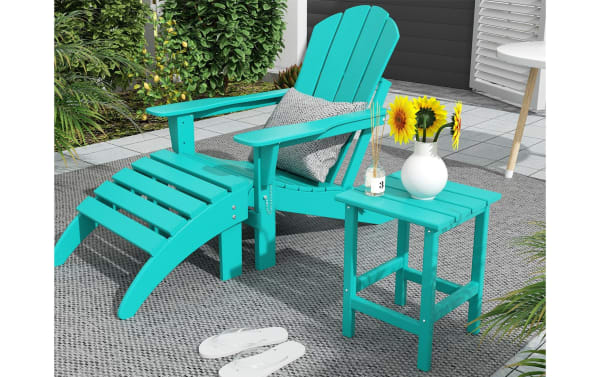 Turquoise Paloma Outdoor Adirondack Side Table in high-density plastic, transitional style, shown with matching Adirondack chair and footrest on patio.