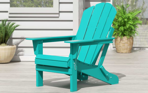 Turquoise Clovie Folding Outdoor Adirondack Chair in high-density plastic with oversized frame, transitional style, and slatted back for patio relaxation.