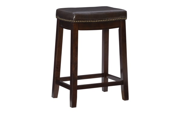 Cielo Brown faux leather backless counter stool with antique brass nailhead trim, rubberwood frame, and deep brown transitional style seat.