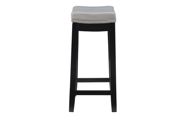 Backless Cielo Gray faux leather counter height stool with silver nailhead trim, black rubberwood frame, and gray polyurethane upholstery.