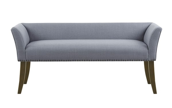 Contemporary Cecile Light Blue Bench with slate blue polyester fabric upholstery, flared arms, low back, bronze nailhead trim, and solid light wood legs.