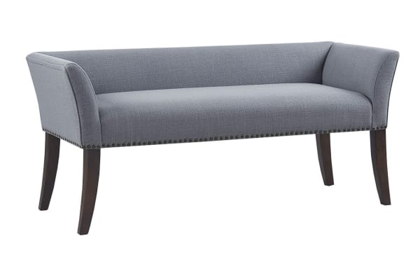 Contemporary Cecile Light Blue Bench with slate blue polyester fabric upholstery, flared arms, low back, bronze nailhead trim, and solid wood legs.