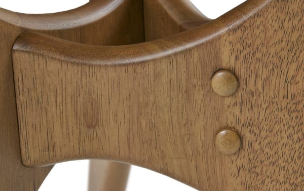 Close-up of the Derby Natural Solid Wood Coffee Table's mid-century modern cross base joint, showcasing natural elm wood grain and smooth rounded wood dowel connectors.