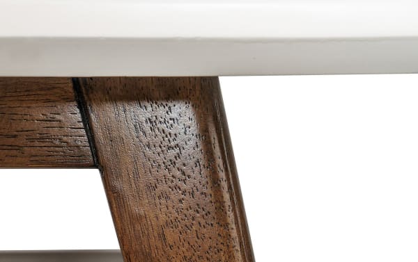 Close-up of the Marcie Pecan Coffee Table’s solid wood leg with a rich pecan finish, showcasing mid-century modern craftsmanship and durability.
