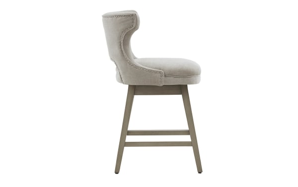 Kaya Light Gray Upholstered Counter Height Swivel Stool with solid wood legs, light gray fabric, pewter nail head trim, and transitional style.