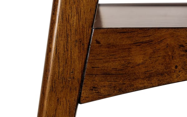 Close-up of the Marcie Pecan End Table corner showcasing its mid-century modern MDF frame in warm pecan finish with an off-white tabletop edge.