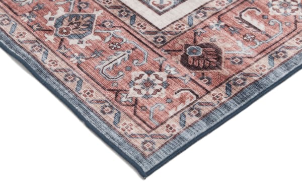 Transitional style Teller 5' x 7' washable rug in red and beige with intricate oriental patterns, made of durable polyester fabric.