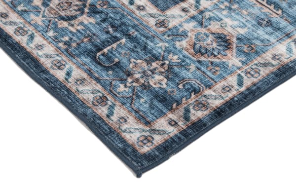 Navy, light blue, and ivory transitional 8' x 10' Teller washable rug with floral oriental pattern, polyester fabric, stain-resistant and machine washable.