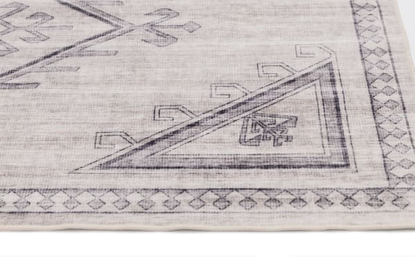 Light gray Altis 5' x 7' vintage transitional rug in polyester fabric with geometric border and foldable, washable design for easy cleaning.