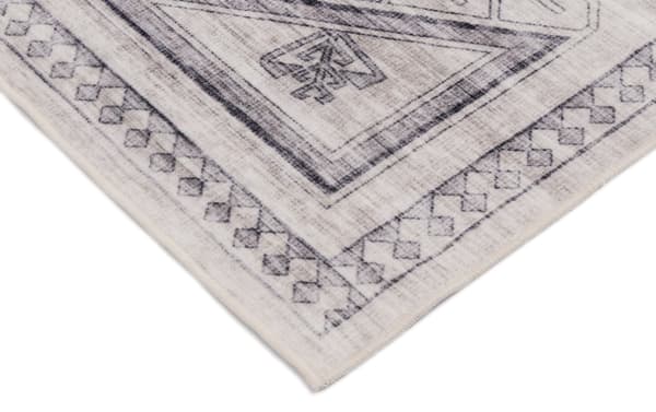 Light gray Altis 5' x 7' transitional vintage rug with geometric border pattern, made of durable polyester fabric, washable and stain-resistant.
