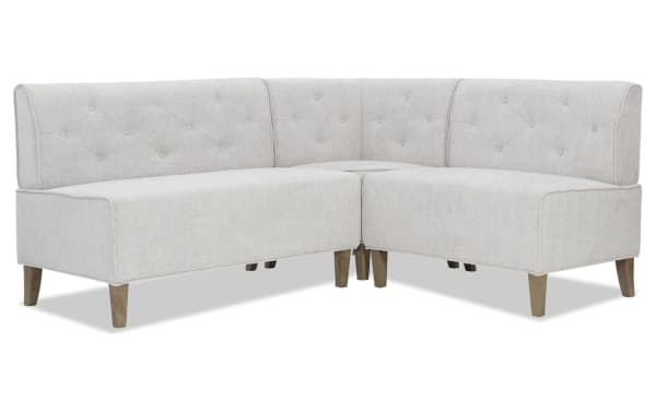Lindie Light Gray Corner Bench with soft gray tweed polyester upholstery, foam cushions, and natural rubberwood legs in a transitional style.