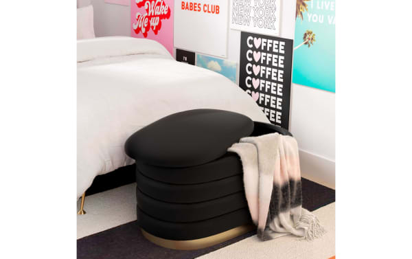 Larson Black Velvet Storage Bench in black velvet with channel-tufted design and gold stainless steel base, offering hidden storage and extra seating.