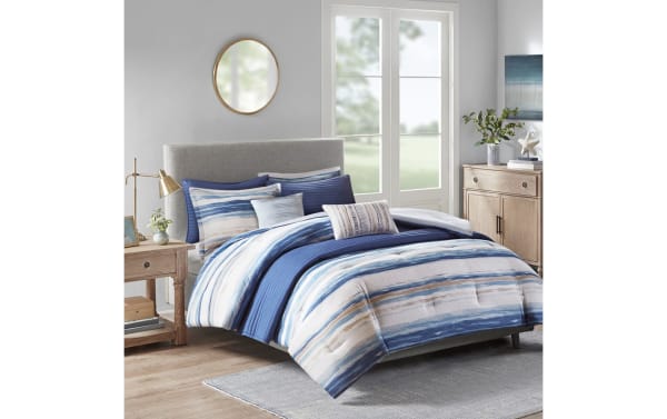 Lucas Full/Queen Blue Abstract 8 Piece Comforter Set in polyester microfiber features blue and white abstract stripes, transitional style, and includes an extra lightweight blanket.