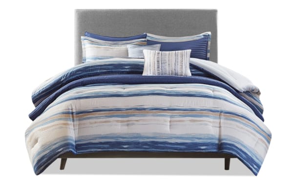 Lucas Full/Queen Blue Abstract 8 Piece Comforter Set with multicolored blue and white abstract stripes, lightweight microfiber fabric, and transitional style for a soothing bedroom oasis.