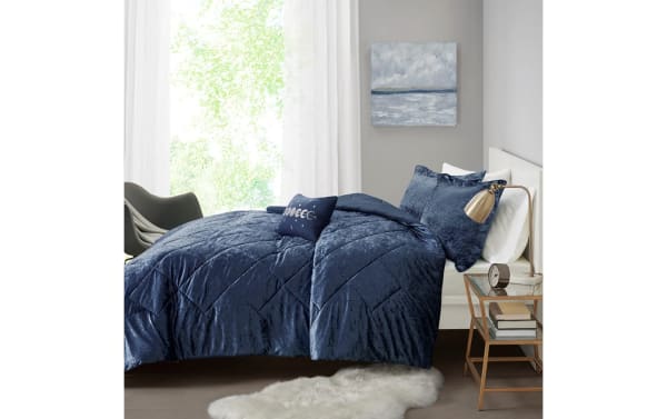Hawken Twin/Twin XL navy blue velvet 3-piece comforter set with plush polyester fabric, contemporary style, quilted texture, and matching pillows.