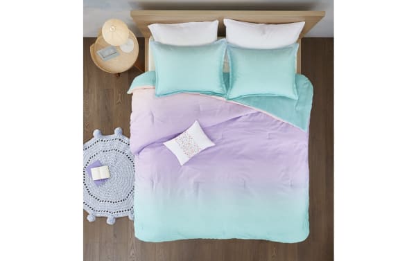 Shimmer Twin/Twin XL reversible 3-piece comforter set in light blue and blush polyester fabric with fairy dust sparkle details, contemporary style.