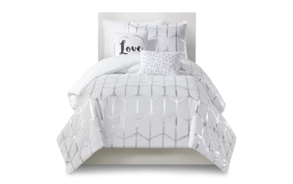 Tina Twin/Twin XL comforter set in white polyester microfiber with silver geometric metallic prints and black polka dot accent pillows, contemporary style.