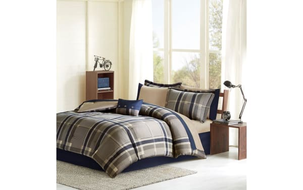 Roderic Twin Taupe Plaid 7 Piece Comforter Set in taupe, navy, and white microfiber with plaid pattern, includes shams and sheets in a transitional style.