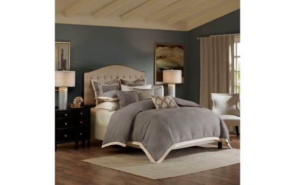 Humphrey King Gray Geometric 9 Piece Comforter Set with polyester fabric, featuring a gray geometric pattern, decorative embroidered and woven pillows, removable insert, and button fastening in a contemporary bedroom setting.