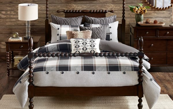 Aspen Lodge Queen Brown Plaid 8 Piece Comforter Set with oversized cotton jacquard comforter, button details, plaid and knit shams, and decorative pillows.