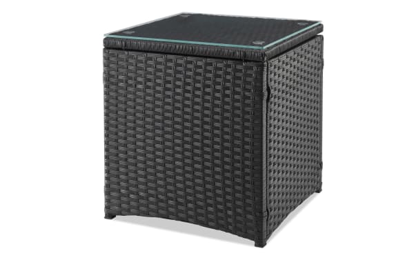 Black wicker side table with tempered glass top, part of Mikado 3 Piece Cream Wicker Conversation Set, featuring durable woven iron and steel construction for outdoor use.