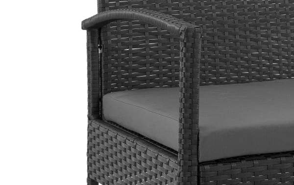 Close-up of the Dianta 3 Piece Gray Wicker Outdoor Conversation Set chair armrest and gray polyester cushion, showcasing transitional style woven iron and steel frame.