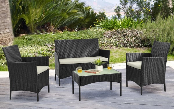Mikado 4 Piece Cream Wicker Outdoor Conversation Set with two chairs, loveseat, and glass-top coffee table in black rattan with cream polyester cushions, transitional style. Durable iron and steel frame, removable washable cushions, ideal for patio, porch, or backyard seating.