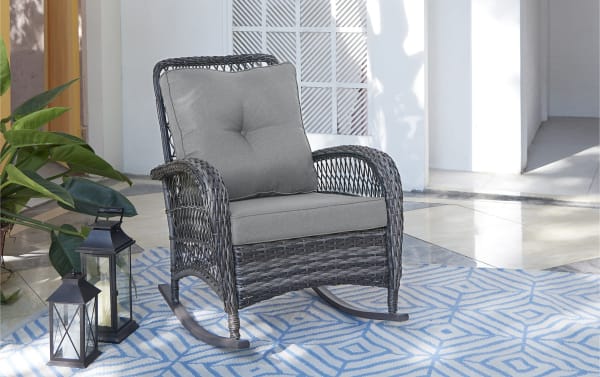 Gray Pianco wicker outdoor rocking chair with plush polyester cushions, iron and steel frame, transitional style for porch or patio seating.