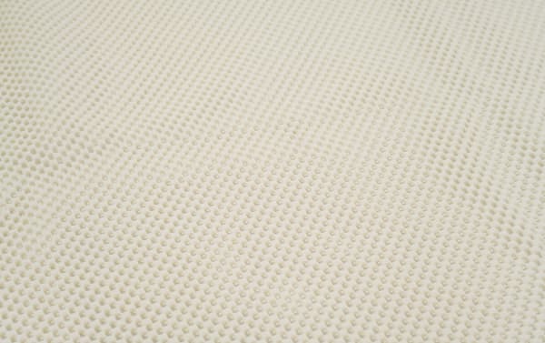 Beige transitional Bob's 5' round Magic Rug Pad made of soft polyester fabric with textured surface for cushion and floor protection.