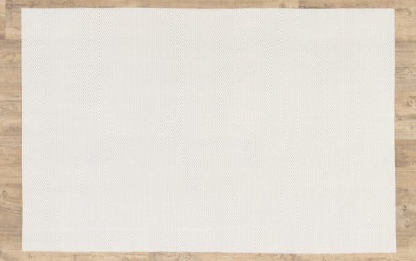 Beige 9' x 12' Bob's Magic Rug Pad in transitional style, made of cushioned polyester fabric to protect wood floors and secure rugs.