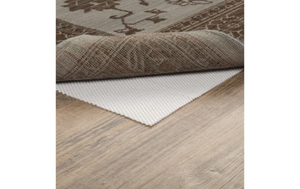 Beige transitional 9' x 12' Bob's Magic Rug Pad made of cushioned polyester fabric, designed to prevent rug slipping and protect wood floors.