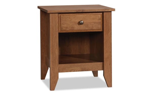 Janis Natural Nightstand with Drawer in warm wood finish, transitional style, featuring a smooth metal runner drawer and open bottom storage shelf.