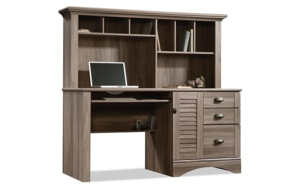 Cove 3 Drawer Oak Desk in transitional style, made of particle board and MDF with oak finish. Features a hutch with cubby hole shelves, slide-out keyboard tray, three drawers, and a vertical CPU storage compartment, ideal for home office organization.