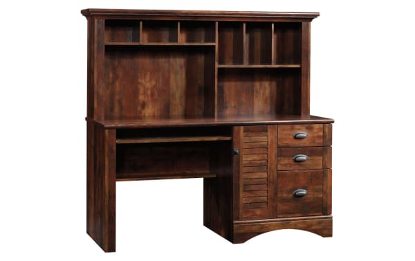 Transitional Cove Cherry 3 Drawer Desk in Curado cherry finish with particle board, metal hardware, louvered door, cubbies, and slide-out keyboard shelf for organized coastal workspace.