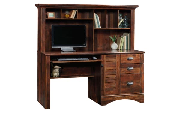 Transitional Cove Cherry 3 Drawer Desk in Curado cherry finish with particle board, metal, louvered door, cubbies, and slide-out keyboard shelf for organized workspace.