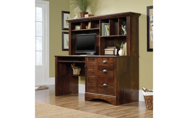 Transitional Cove Cherry 3 Drawer Desk in Curado cherry finish, particle board and metal, with louvered door, cubbies, slide-out keyboard shelf, and coastal beachy style.