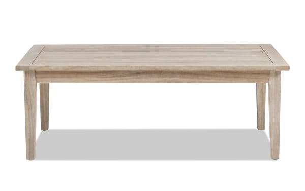 Gardner Natural Outdoor Coffee Table in transitional style, made of solid acacia wood with a slatted top and natural oil-based stain for rustic durability.
