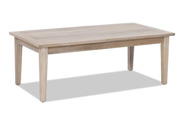Gardner Natural Outdoor Coffee Table in transitional style, made of solid acacia wood with a slatted top and natural oil stain for rustic durability.