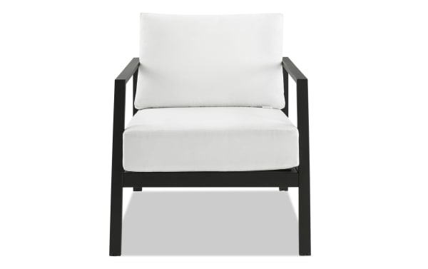 Suvi White Aluminum Outdoor Chair with black powder-coated aluminum frame, white acrylic cushions, and transitional style from Suvi Outdoor collection.