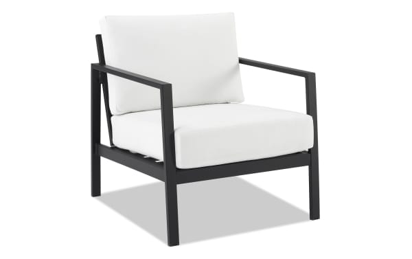 Suvi White Aluminum Outdoor Chair with black powder-coated aluminum frame, white acrylic cushions, and transitional style for durable patio seating.