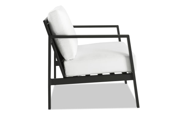 Suvi White Aluminum Outdoor Chair with black powder-coated aluminum frame, white acrylic cushions, and transitional style for patio or porch seating.