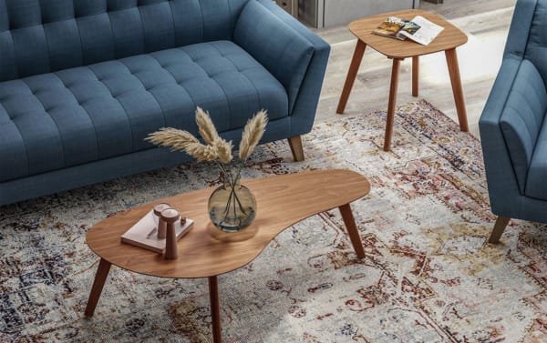 Maderna Brown End Table from the Maderna collection features walnut veneer, curved top, and slanted legs in an industrial Scandinavian style.