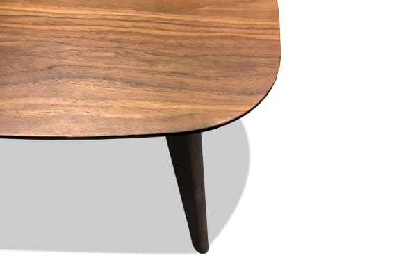 Maderna Brown End Table with walnut veneer curved top and tapered dark brown slanted legs, industrial Scandinavian style for small spaces.