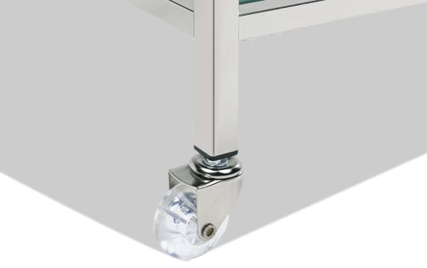 Clear caster wheel attached to a chrome leg of the Oakley Silver Bar Cart, showcasing its tempered glass and contemporary chrome design.