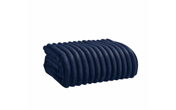 Folded navy blue ribbed plush fleece blanket with soft, textured fabric for warmth and comfort, ideal for home or travel use.