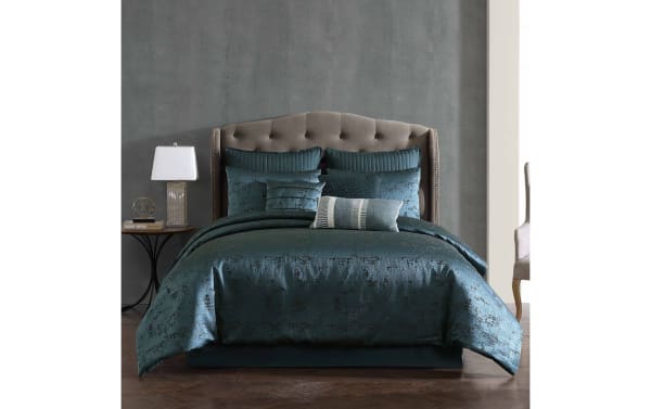 Contemporary Cambria Queen Blue Vintage reversible 9-piece comforter set in textured blue polyester fabric with oversized comforter, multiple shams, and decorative pillows.