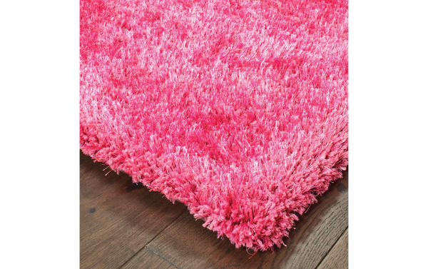 Contemporary Jasmine 3' x 5' pink solid shag rug with plush polyester fabric, offering a cozy, soft texture ideal for cushioning floors.