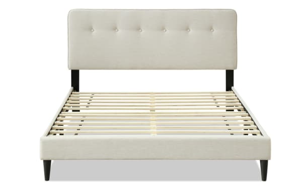 Lila King beige upholstered platform bed with button tufted fabric polyester headboard, wooden slats, and tapered legs in transitional style.