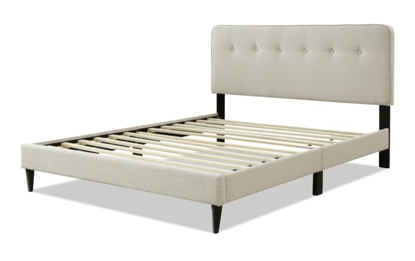 Lila King beige upholstered platform bed with button tufted fabric polyester headboard, wooden slats, and black tapered legs in transitional style.